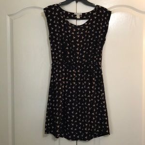 Navy dress with pink bird design. Runs small fit.